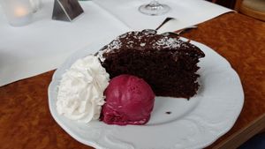 Chocolate cake, whipped cream and ice cream at Die Weinstube Nachhaltig Geniessen in Zeltingen