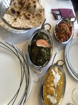 Vegan roti, chana masala, sag aloo and vegetable korma. All delicious  at Saffron Indian Kitchen in Praia Da Luz