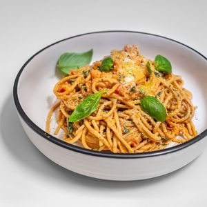 Creamy tomato and basil spaghetti featuring fresh tomatoes and basil in a deliciously creamy house-made cashew-based sauce, topped with vegan parmesan (optional) at Feelyoucan Takeaway - Maybe closed in Bankstown