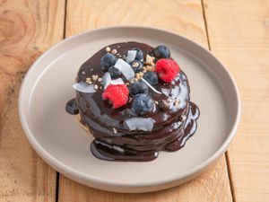 Pancakes with Chocolate and seaonal fruits, glutenfree option available at Natury in Barcelona