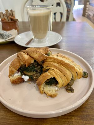 croissant with spinach, mushrooms and vegan cream cheese + latte (oat) macchiato  at Natury in Barcelona