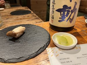 Left: trumpet mushroom sushi. Center: Sake. Right: Palate-cleansing vegetables (I forget the name)  at veggie tempo & sushi in Tokyo