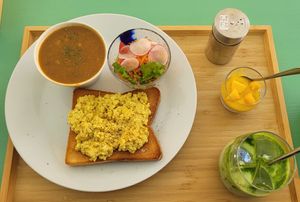 Vegan egg scramble on toast, lentil soup, quinoa salad, mango chia pudding, and an iced matcha latte! at The Kind  in Kyoto