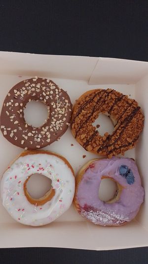 The vegan donuts in the pic are the white and the purple, there were also a yellow one (lemon) but I hate it on my way home so no pic :) at The Original American Donuts in Toulouse
