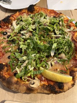 The vegan pizza was the worst thing we ordered. Romaine lettuce over dry toppings and weird cheese. Nice crust, though.  at Left Field Brewery in Toronto