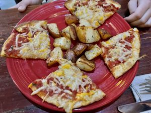 Cheese pizza and roasted potatoes  at The Grain Cafe in Los Angeles