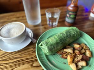 Breakfast burrito and chai lattee  at The Grain Cafe in Los Angeles