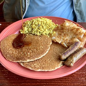 Pancakes, sausage, tofu scramble, hash browns  at The Grain Cafe in Los Angeles