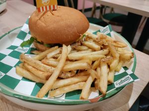 The burger comes with fries at Neat Burger - Merlata Bloom in Milan