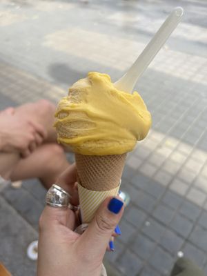 Vegan Mango ice cream with small cone  at Carambola in Barcelona