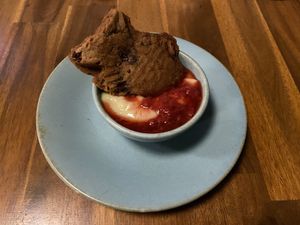 Taiyaki - fish-shaped waffle cake filled with anko swimming in housemade custard and seasonal fruit compote  at Muku Ramen Bar in Belconnen