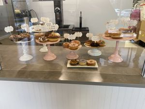 Donut display- vegan options in back left (cinnamon sugar, glazed, and mixed berry)  at NH Donut Co in Bedford