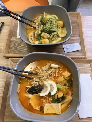 tom yum soup base with a variety of veggies, tofu, mushrooms, noodles and tteok  at Yangguofu Malatang (杨国福杜塞店) in Dusseldorf