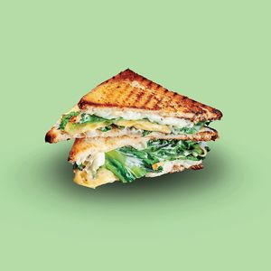 Vegan Breakfast Sandwich & Potatoes (multigrain bread, vegan eggs, vegan cheese, vegan meat, avocado, vegan BBQ sauce, lettuce, side of house potatoes) at SQUAREAT in Miami Beach