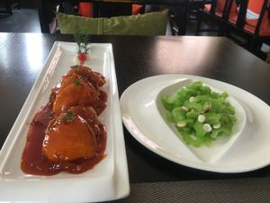 Mock fish dish and bitter melon salad at Buddha's Bite in Beijing