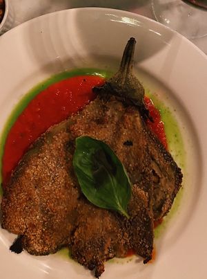 Melanzane a la pizzaiola, served with crispy chickpeas. Really good.  at Babae in Florence