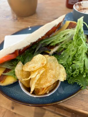 FLT - fake ‘bacon’, lettuce, tomato, tomato puree, vegan cheeze & crisps at The Towpath Cafe in Edinburgh