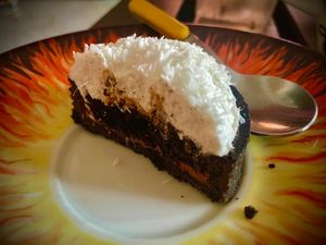 Black chocolate crust, coconut mousse, almond filling  at Julietta Pastry and Lab in Rome