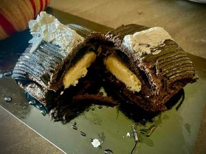 Black chocolate pastry filled with coconut cream  at Julietta Pastry and Lab in Rome