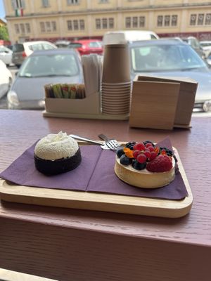 Coconut cake and fruit cake with lemony custars inside   at Julietta Pastry and Lab in Rome