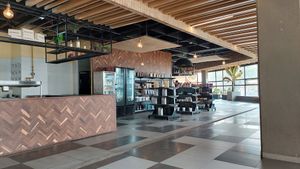 Kitchen and shop inside the restaurant at Herbívoro - La Felicidad  in Bogota