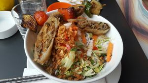 Sat bun with spring roll and veggie sate at Charlie in Munich
