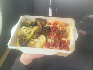 Hummus with roast veg. Very tasty. I don't usually like broccoli, but this was excellent! The semi-dried tomatoes made the whole thing so good. at Olivka in Almaty