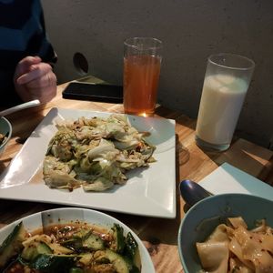 Szechuan pepper cabbage stir-fry, hand-pulled Tsula Tsula noodles, cucumber salad, soy milk, iced tea at Chin Burger 秦堡 in Cologne