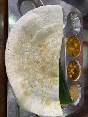 Plain Dasa with chickpea curry, coconut chutney, pumpkin curry  at Vishnu Vihar Vegetarian Hotel in Kandy