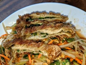 Close up of mock meat on Papaya salad. Soy product that is layered with green onions in-between! at Van Hanh Restaurant in Portland