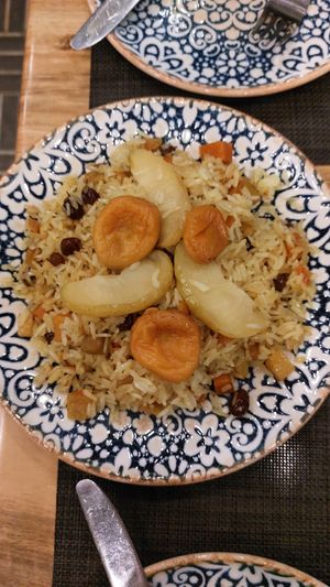 Pilaf rice with fruits and raisin. There might be butter but I'm not sure. They don't really know the difference between vegetarian and vegan at Afsona in Tashkent