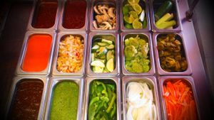 Salad bar full of fresh vegtables. You choose how you want them to make you food and what you want in your burrito, or bowl,salad, or quesadilla.  at Burrito Surf Burrito Shop in Cabo San Lucas