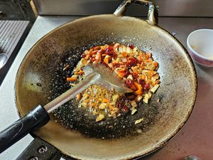 Making chili jam at May Kaidee x Morning Glory Home Cookery School in Chiang Mai