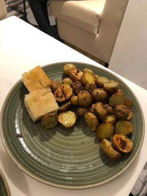 Roasted potatoes with rosemary and rosemary oil at AUH - Pearl Lounge - TA in Abu Dhabi