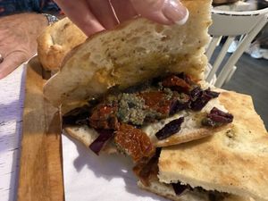 Sun dried tomatoes, olive tapenade, wish it had a little more of the curried red cabbage   at Schiaccia Passera in Florence