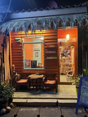 Small outdoor seating area   at Shark's Shack in Chiang Mai