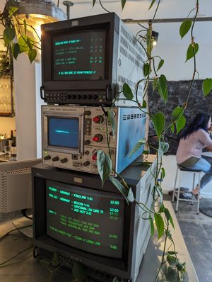 Drinks menu on old school monitors at Luntian in Auckland