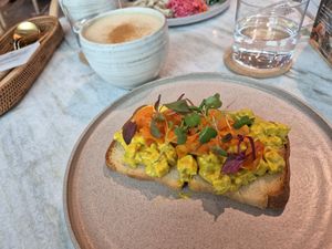 Vegan tofu egg and salmon toast. Chai in the background at Alchemy Tokyo -Azabudai Hills - アルケミー in Tokyo