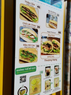 Menu stand at Bánh Mì Xanh in Ho Chi Minh City