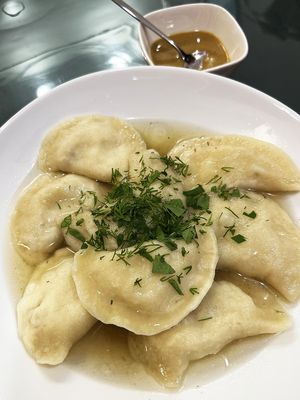 Vegan dumplings with potato, greens, vegan broth, and hot homemade mustard at BORSHÖF in Yerevan
