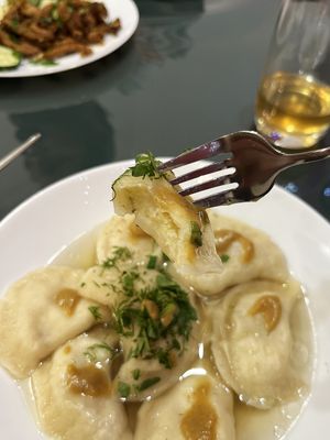 Vegan dumplings with potato, greens, vegan broth, and hot homemade mustard, inner world at BORSHÖF in Yerevan