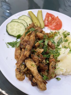 Delicious vegan soy goulash, with mashed potatoes, greens, fresh cucumber and tomato, and pickles.  at BORSHÖF in Yerevan