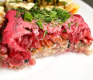 Veganized "Selyodka pod shuboy" ("Herring under a fur coat") salad, layers: boiled potato, tofu, nori, soy sauce, boiled carrot, boiled beetroot, vegan mayo, greens at BORSHÖF in Yerevan