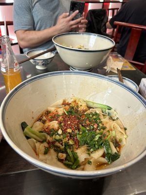 Giant bowls and warm orange sodaa  at Shangzhai Leizhali Noodle Restaurant - 尚寨嫽扎咧面馆(钟楼店) in Xian