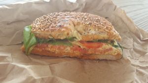 Toasted everything bagel with homemade hummus, tomato, spinach, hot sauce at The Green Bean in New Bedford