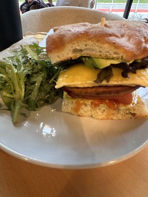 Vegan breakfast sandwich with house made sausage and just egg on focaccia. Thought it was great! And side salad.   at Silver Fern in Minneapolis