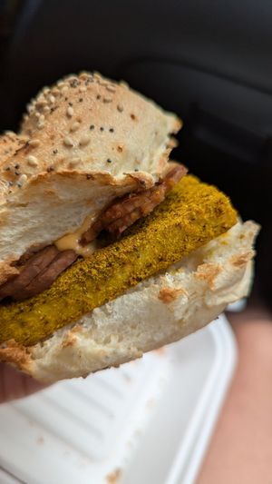 Vegan breakfast sandwich - tofu egg, tempeh bacon, Sriracha maple sauce on a everything hard roll at Hydra Coffeehouse in Rochester