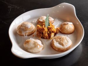 Vegan Gundappam / fat appam, fermented rice treats with roasted coconut chambal and a drizzle of coconut milk, prepared in a Dutch oven. Photo credits to Kunthaville at Kunthaville in Central Singapore