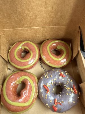 3 Strawberry donuts and a Birthday Cake one!  at Holey Grail Donuts  in Kapaa