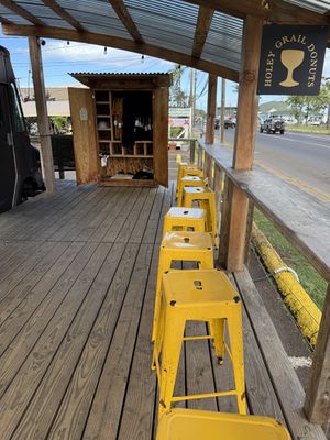 Seating area and merch too  at Holey Grail Donuts  in Kapaa